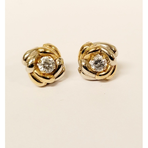 128 - A PAIR OF 9CT DUAL TONED GOLD STUD EARRINGS, with a central solitaire clear gemstone setting, marked... 