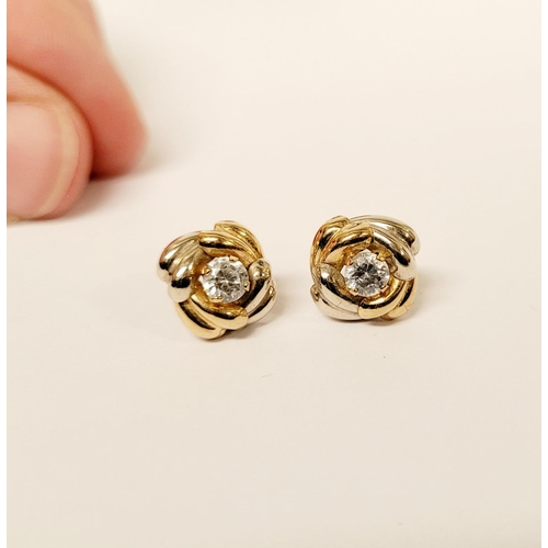 128 - A PAIR OF 9CT DUAL TONED GOLD STUD EARRINGS, with a central solitaire clear gemstone setting, marked... 