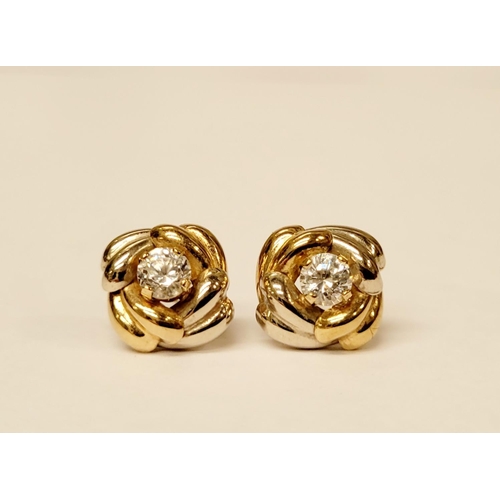 128 - A PAIR OF 9CT DUAL TONED GOLD STUD EARRINGS, with a central solitaire clear gemstone setting, marked... 