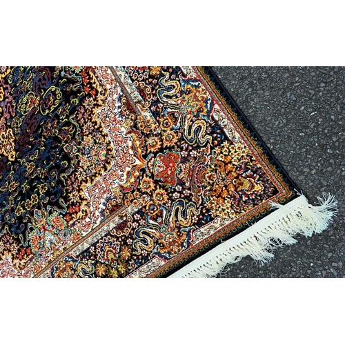 180 - A PERSIAN BARZIN FLOOR RUG dark blue, in style of classical Persian silk rug; striking central flora... 