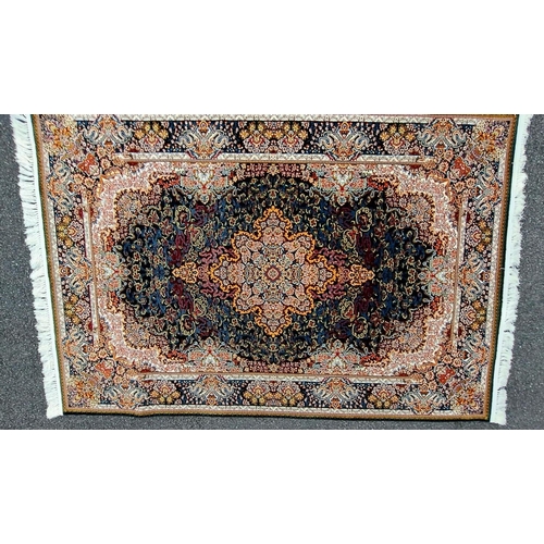180 - A PERSIAN BARZIN FLOOR RUG dark blue, in style of classical Persian silk rug; striking central flora... 