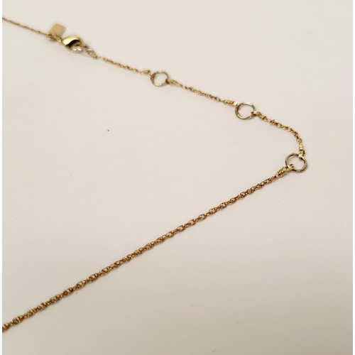 223 - A CASED ALEXIS BITTAR LUCITE & GOLD PENANT NECKLACE, the oval shaped pendant is a bright golden colo... 