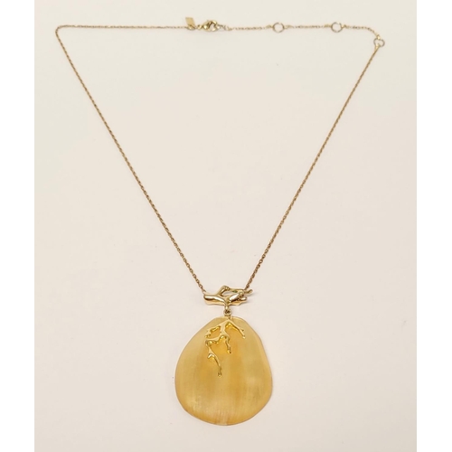 223 - A CASED ALEXIS BITTAR LUCITE & GOLD PENANT NECKLACE, the oval shaped pendant is a bright golden colo... 