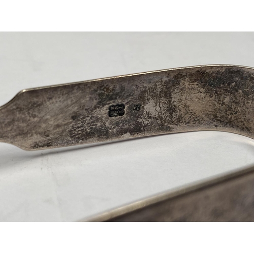 231 - TWO GEORGE V SILVER SUGAR TONGS, (i) Maker Holland, Aldwinckle & Slater (Thomas Alfred Slater, Walte... 