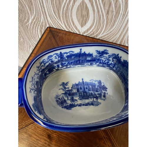 281 - A BLUE & WHITE COLOURED FOOT BATH PLANTER, decorated to both the exterior and interior with building... 