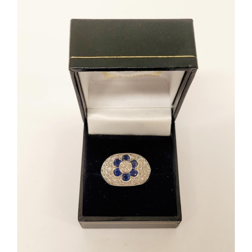 82 - A PRETTY 18CT WHITE GOLD SAPPHIRE & DIAMOND FLORAL CLUSTER / DRESS BOMBE SHAPED RING, the curved set... 