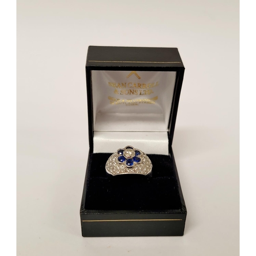 82 - A PRETTY 18CT WHITE GOLD SAPPHIRE & DIAMOND FLORAL CLUSTER / DRESS BOMBE SHAPED RING, the curved set... 