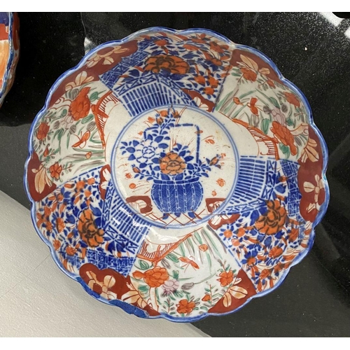 102 - TWO VINTAGE JAPANESE IMARI STYLE PLATES, both with scalloped rim and painted panels to interior and ... 