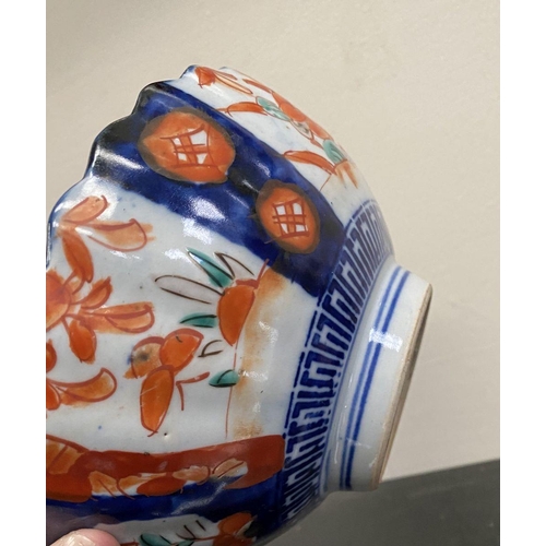 102 - TWO VINTAGE JAPANESE IMARI STYLE PLATES, both with scalloped rim and painted panels to interior and ... 