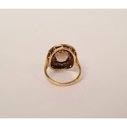 104 - A VERY FINE 9CT YELLOW GOLD SMOKY QUARTZ DRESS RING, the large oval shaped smoky quartz stone is set... 