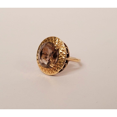 104 - A VERY FINE 9CT YELLOW GOLD SMOKY QUARTZ DRESS RING, the large oval shaped smoky quartz stone is set... 