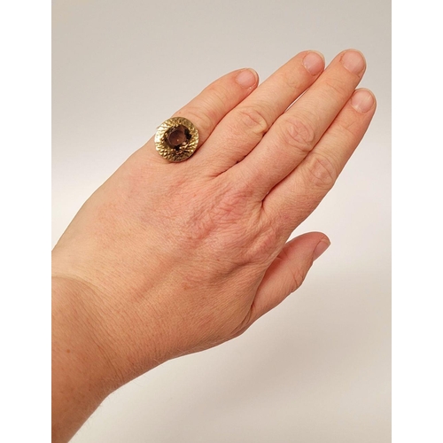 104 - A VERY FINE 9CT YELLOW GOLD SMOKY QUARTZ DRESS RING, the large oval shaped smoky quartz stone is set... 