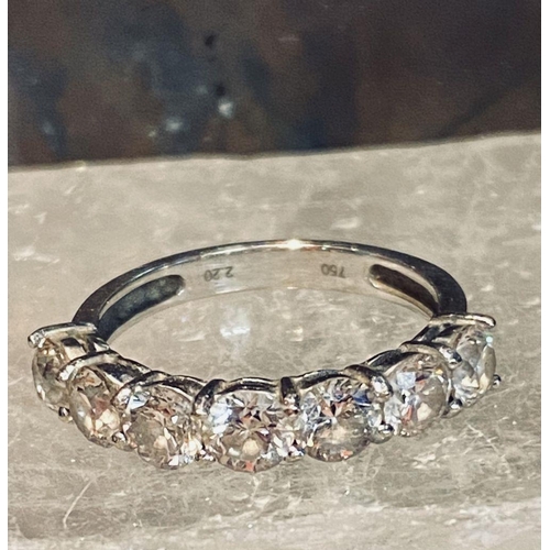 107 - AN 18CT WHITE GOLD 7 STONE DIAMOND RING, the diamonds in a claw setting. Total weight 2.20cts, with ... 