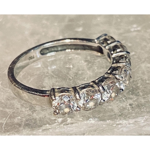 107 - AN 18CT WHITE GOLD 7 STONE DIAMOND RING, the diamonds in a claw setting. Total weight 2.20cts, with ... 