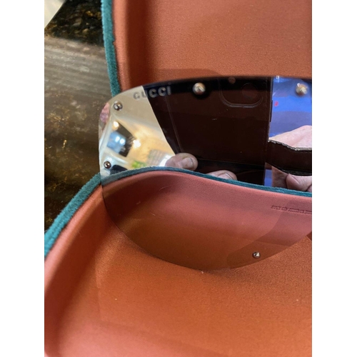 113 - A PAIR OF CASED GUCCI SUNGLASSES, comes with purchase receipts and papers, never used.