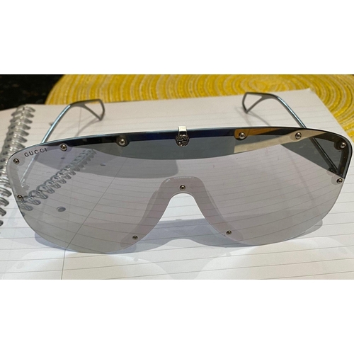 113 - A PAIR OF CASED GUCCI SUNGLASSES, comes with purchase receipts and papers, never used.
