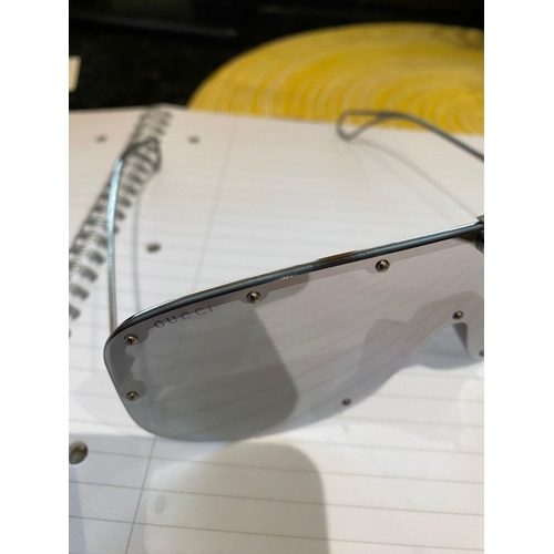 113 - A PAIR OF CASED GUCCI SUNGLASSES, comes with purchase receipts and papers, never used.