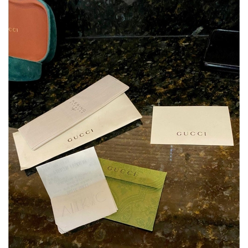 113 - A PAIR OF CASED GUCCI SUNGLASSES, comes with purchase receipts and papers, never used.