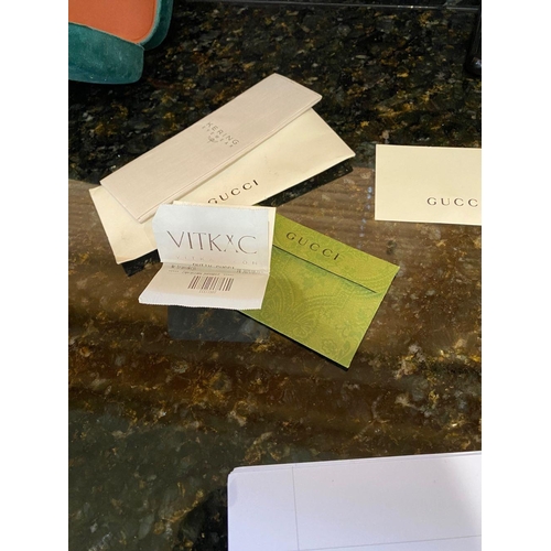 113 - A PAIR OF CASED GUCCI SUNGLASSES, comes with purchase receipts and papers, never used.