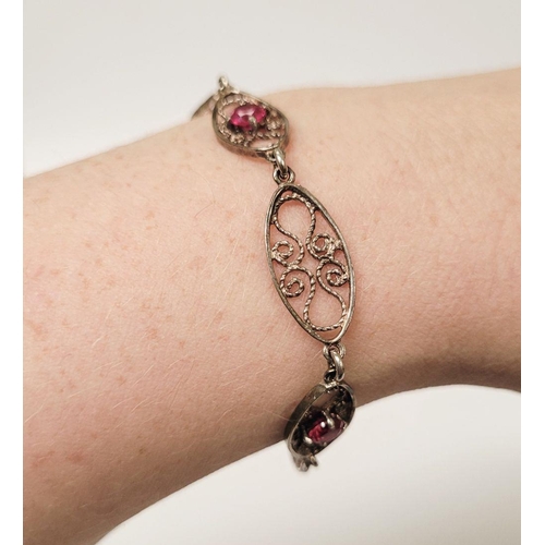 114 - A VINTAGE STERLING SILVER FILGREE WORK BRACELET WITH PINK GEMSTONE SETTING, a lovely piece of jewell... 