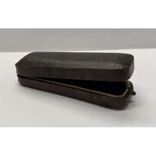 118 - A DELIGHTFUL CASED ANTIQUE DIAMOND HAT PIN, with floral design, having a central diamond flanked by ... 