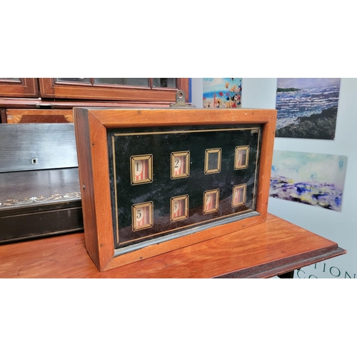 189 - AN ANTIQUE DOVE JOINTED REVERSE PAINTED GLAZED BELL-BOX, with red/white striped number plates, 7 pla... 