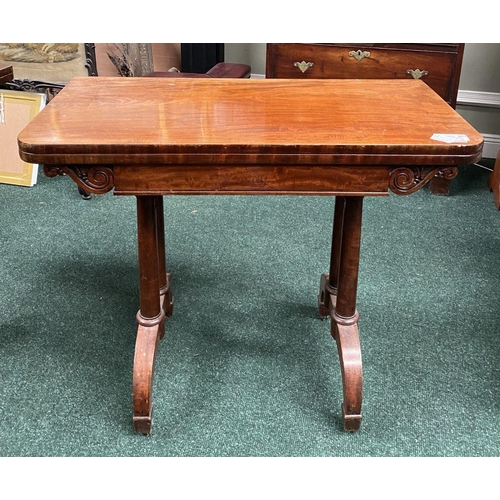 191 - AN ATTRACTIVE MAHOGANY FOLD OVER CARD TABLE, with carved frieze, raised on a pair of side pods, each... 