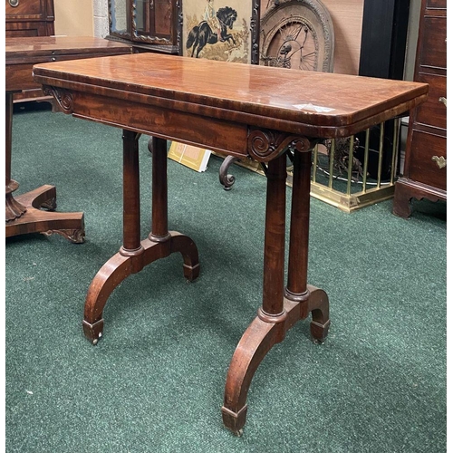 191 - AN ATTRACTIVE MAHOGANY FOLD OVER CARD TABLE, with carved frieze, raised on a pair of side pods, each... 