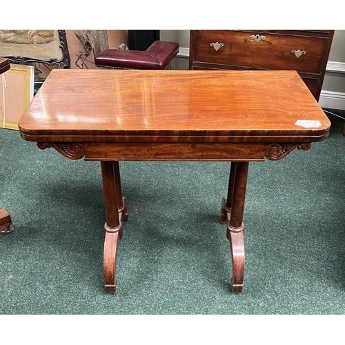 191 - AN ATTRACTIVE MAHOGANY FOLD OVER CARD TABLE, with carved frieze, raised on a pair of side pods, each... 