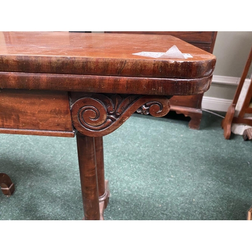 191 - AN ATTRACTIVE MAHOGANY FOLD OVER CARD TABLE, with carved frieze, raised on a pair of side pods, each... 