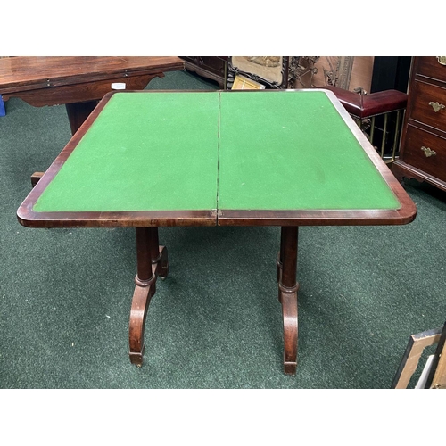 191 - AN ATTRACTIVE MAHOGANY FOLD OVER CARD TABLE, with carved frieze, raised on a pair of side pods, each... 