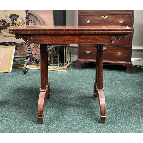 191 - AN ATTRACTIVE MAHOGANY FOLD OVER CARD TABLE, with carved frieze, raised on a pair of side pods, each... 
