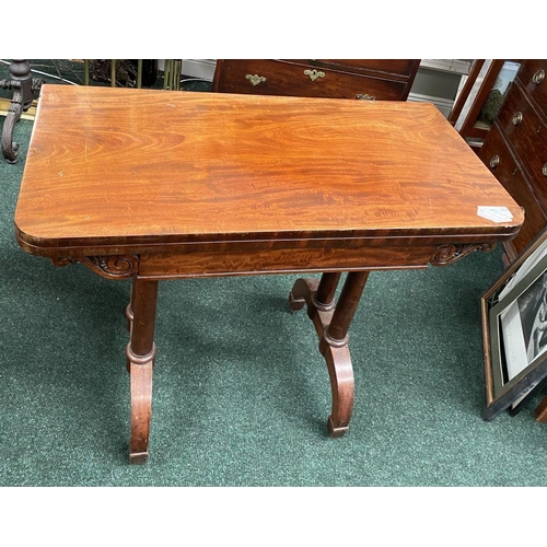 191 - AN ATTRACTIVE MAHOGANY FOLD OVER CARD TABLE, with carved frieze, raised on a pair of side pods, each... 