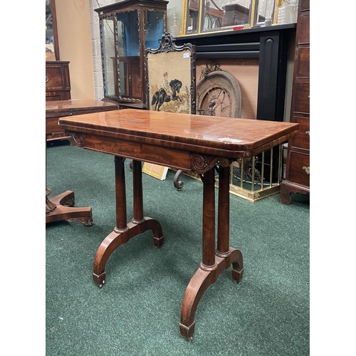191 - AN ATTRACTIVE MAHOGANY FOLD OVER CARD TABLE, with carved frieze, raised on a pair of side pods, each... 