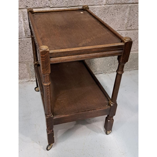 192 - A SMALL TWO-TIER QUATERSAWN OAK WHAT-NOT / TROLLEY, on block and column legs, with distinctive quart... 