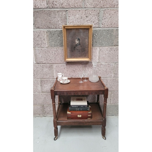 192 - A SMALL TWO-TIER QUATERSAWN OAK WHAT-NOT / TROLLEY, on block and column legs, with distinctive quart... 