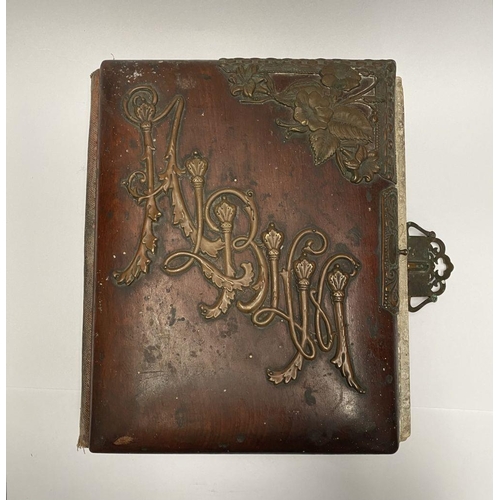202 - A 19TH CENTURY LEATHER EMBOSSED PHOTO ALBUM, containing a variety of monochrome photographic portrai... 