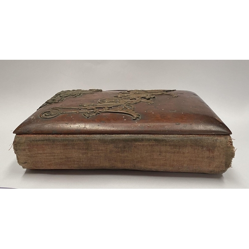 202 - A 19TH CENTURY LEATHER EMBOSSED PHOTO ALBUM, containing a variety of monochrome photographic portrai... 