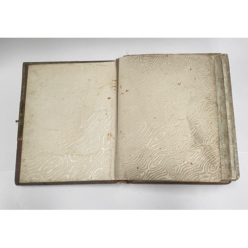 202 - A 19TH CENTURY LEATHER EMBOSSED PHOTO ALBUM, containing a variety of monochrome photographic portrai... 