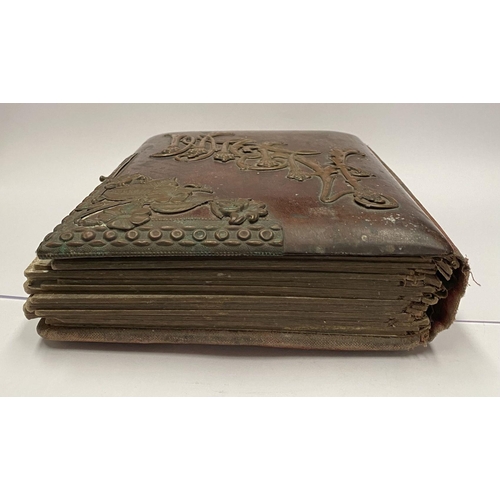 202 - A 19TH CENTURY LEATHER EMBOSSED PHOTO ALBUM, containing a variety of monochrome photographic portrai... 