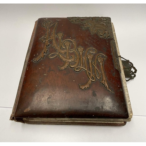 202 - A 19TH CENTURY LEATHER EMBOSSED PHOTO ALBUM, containing a variety of monochrome photographic portrai... 