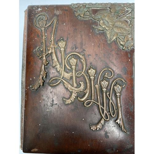 202 - A 19TH CENTURY LEATHER EMBOSSED PHOTO ALBUM, containing a variety of monochrome photographic portrai... 
