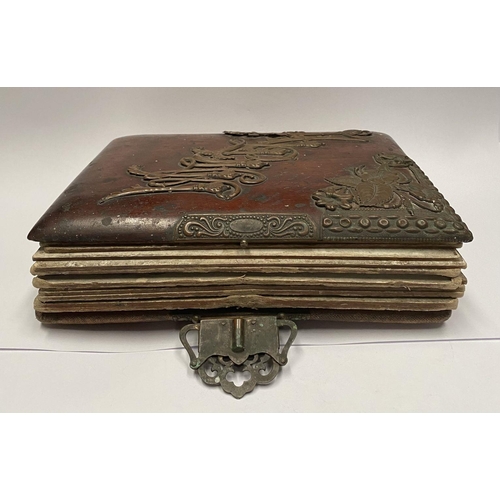 202 - A 19TH CENTURY LEATHER EMBOSSED PHOTO ALBUM, containing a variety of monochrome photographic portrai... 