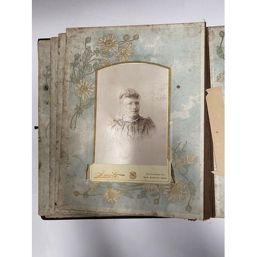 202 - A 19TH CENTURY LEATHER EMBOSSED PHOTO ALBUM, containing a variety of monochrome photographic portrai... 