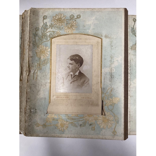 202 - A 19TH CENTURY LEATHER EMBOSSED PHOTO ALBUM, containing a variety of monochrome photographic portrai... 
