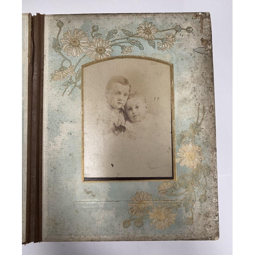 202 - A 19TH CENTURY LEATHER EMBOSSED PHOTO ALBUM, containing a variety of monochrome photographic portrai... 