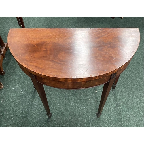 214 - A BRIGHT DEMI LUNE GEORGIAN FLAME MAHOGANY FOLD OVER CARD TABLE, presenting a beautiful finish with ... 