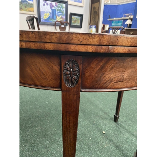 214 - A BRIGHT DEMI LUNE GEORGIAN FLAME MAHOGANY FOLD OVER CARD TABLE, presenting a beautiful finish with ... 