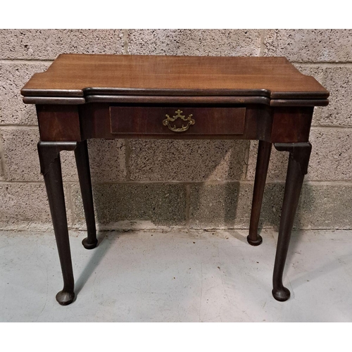 216 - A GOOD GEORGE III FOLD OVER MAHOGANY TEA TABLE with a break front design to the fold over top, venee... 