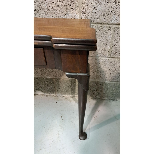 216 - A GOOD GEORGE III FOLD OVER MAHOGANY TEA TABLE with a break front design to the fold over top, venee... 